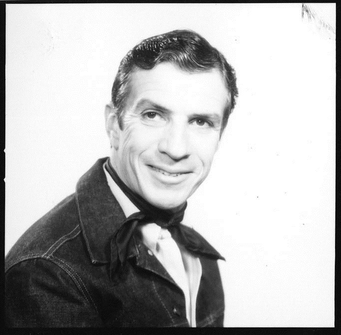 A headshot of Clayton Garrison