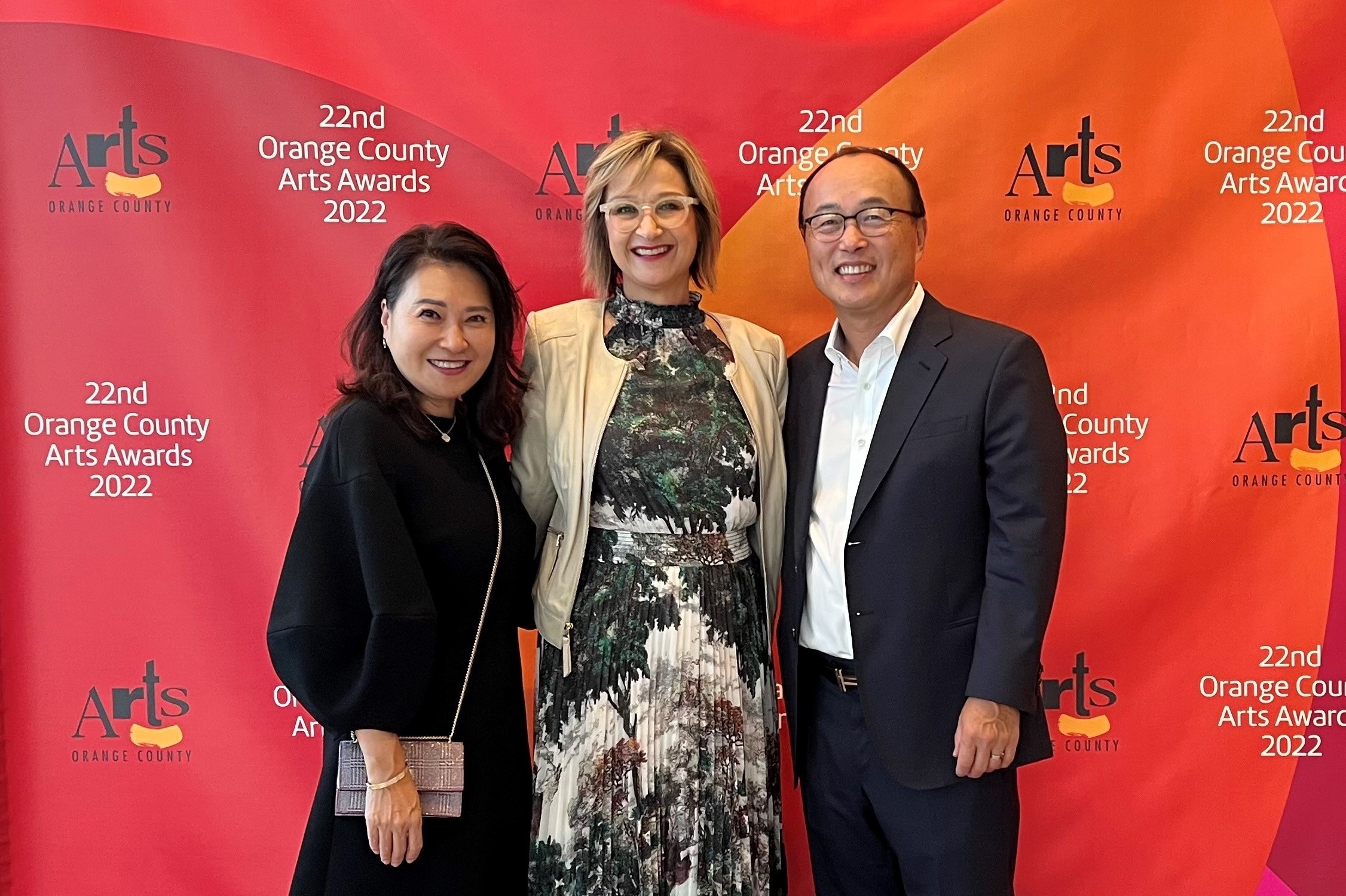 Carol and Eugene Choi, UCI Trustees and Arts supporters, with Tiffany López 