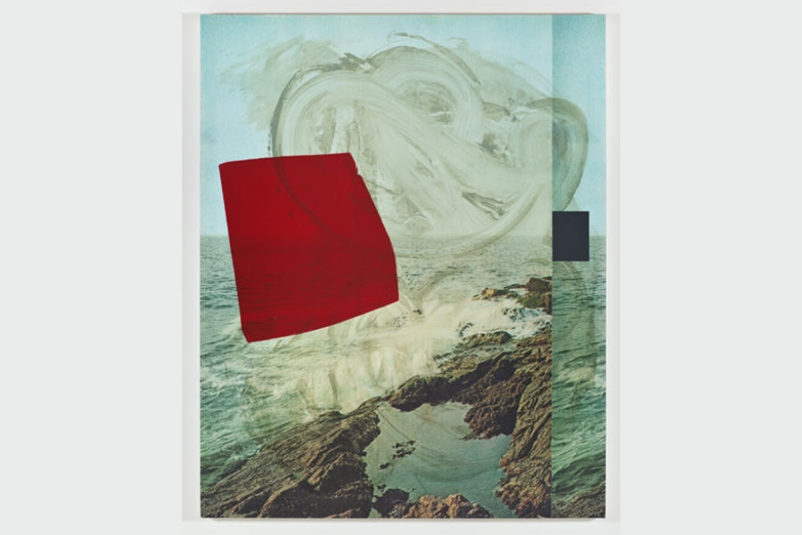 A mixed-media artwork combines a coastal landscape with abstract elements. A photograph of rocky shoreline and ocean water is overlaid with a translucent, brushstroke-like form and bold geometric shapes, including a large red square and a smaller dark gray square, creating a layered and contemporary composition.