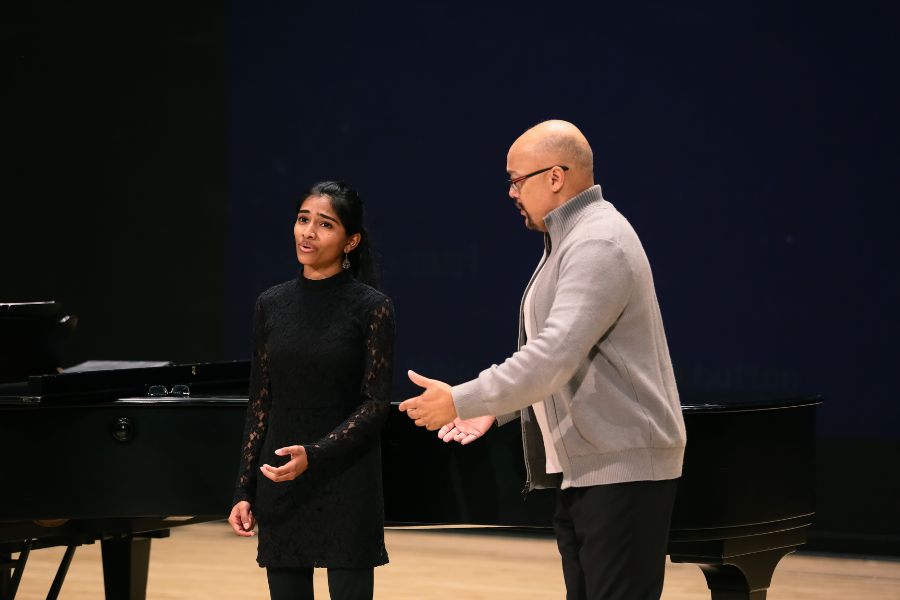 Taylor instructs Nivi Saishankar during a vocal arts class in Winifred Smith Hall. 