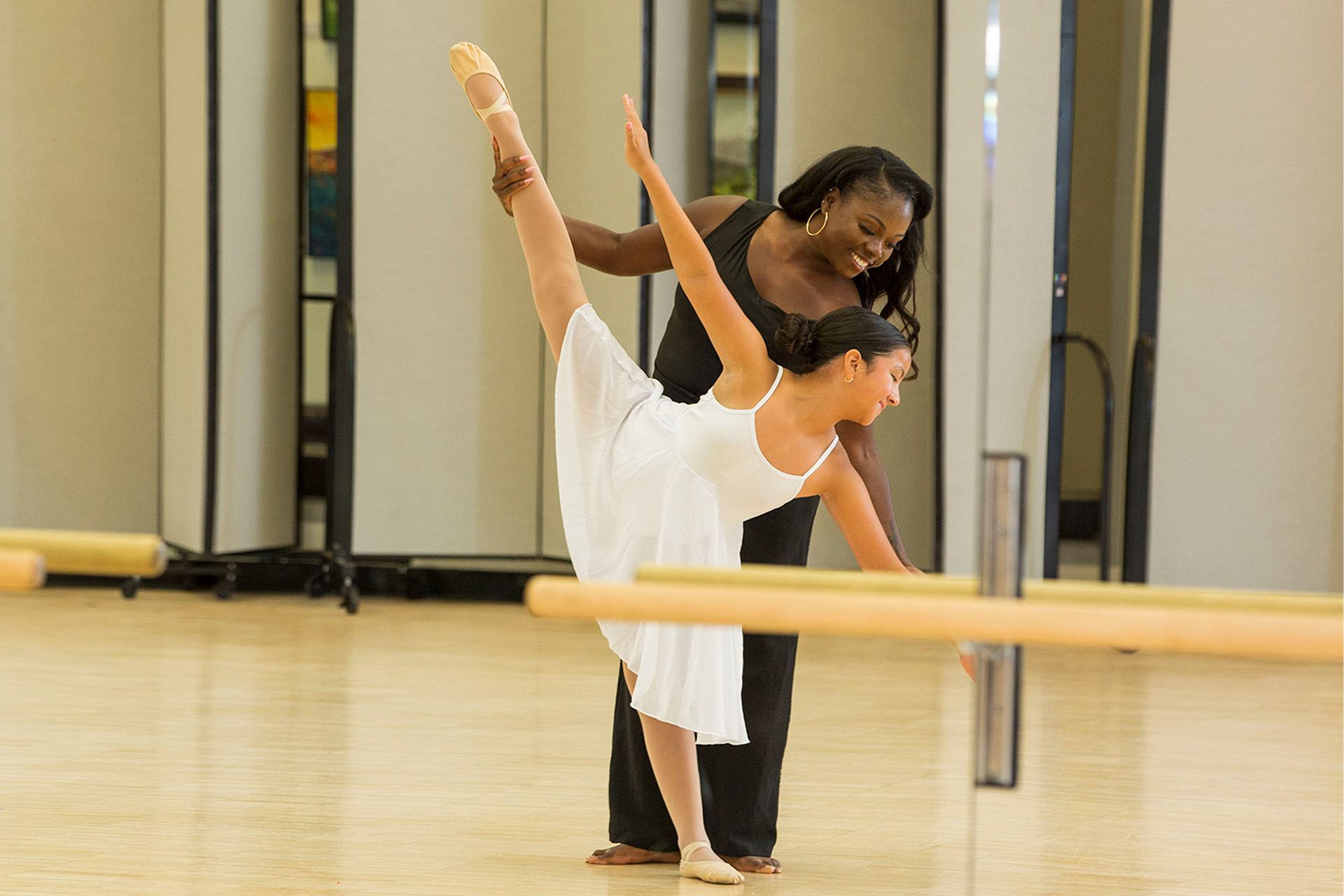 Sakina Ibrahim works with Santa Ana resident and student Celeste Nunez.