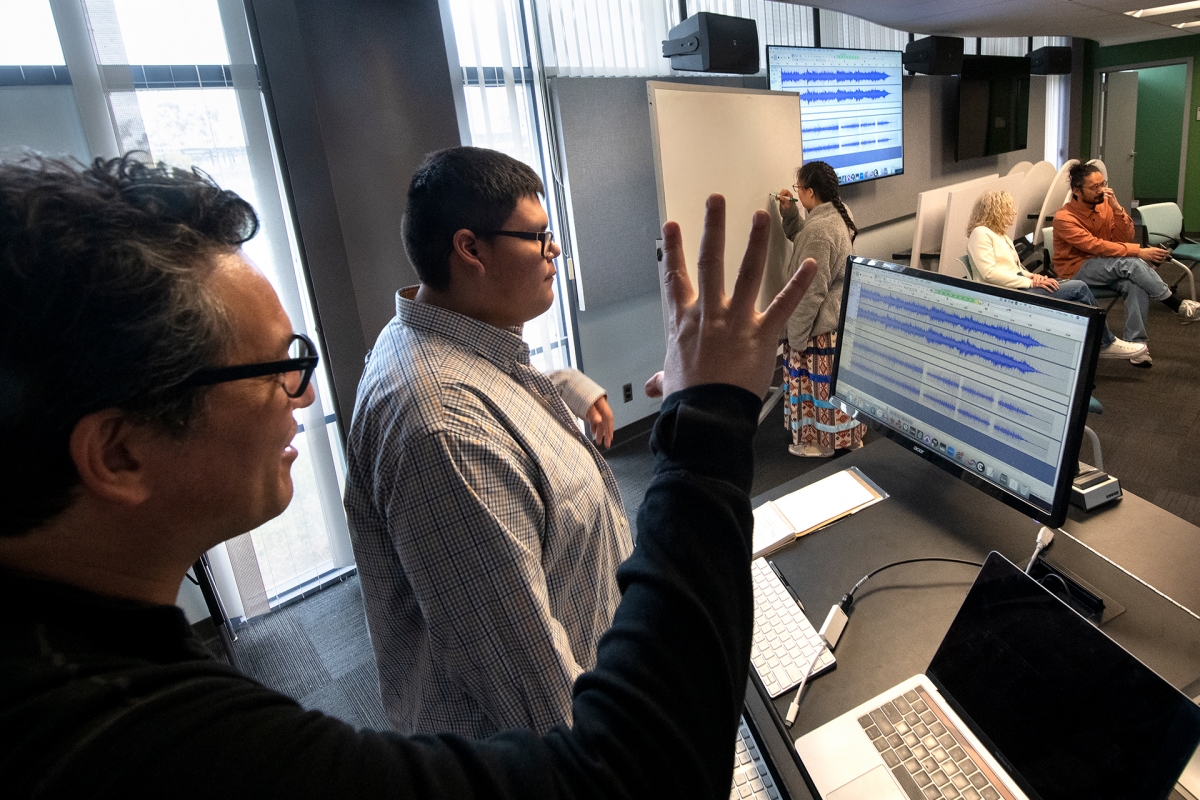  Kojiro Umezaki and Lame Deer High School student Kaleb Mason edit an audio recording of Kaline’s dance. 