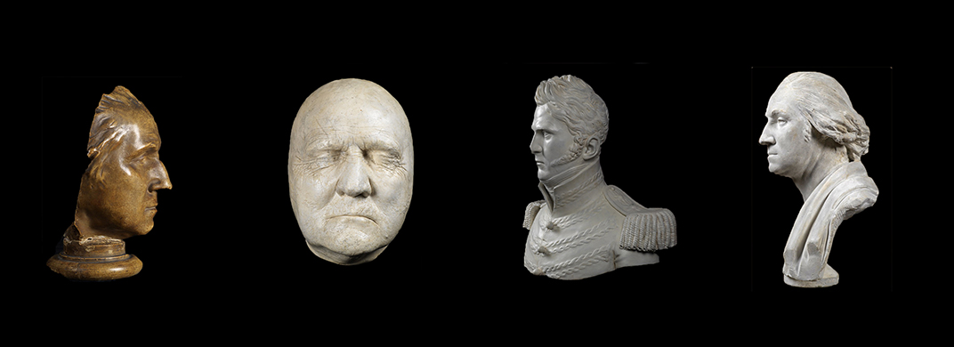 Four sculpted busts displayed against a black background, including a bronze profile head and three light-colored plaster or marble portraits showing detailed facial features from different historical styles.