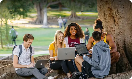 Students sitting together outside 