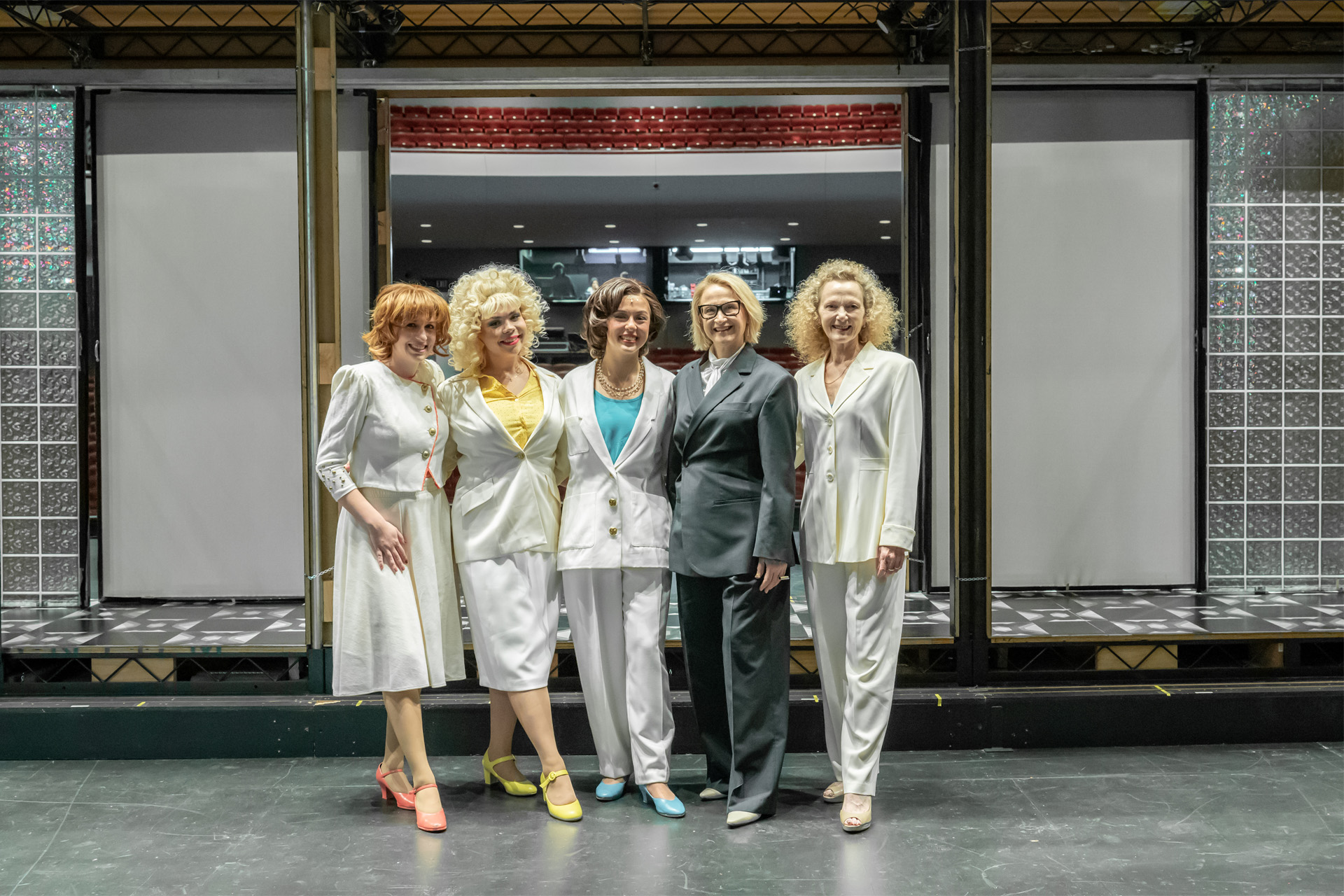 (left to right) 9 to 5 cast members Ruby Lapeyre, Ashlyn Filippone, Sloane Ptashek, Dean Tiffany López and Myrona DeLaney in the Irvine Barclay Theatre. Photo by Jeanine Hill.