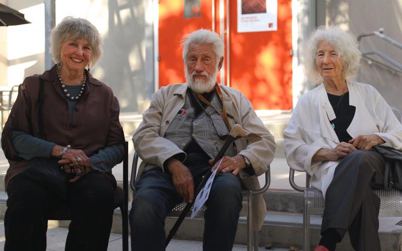 (Pictured: Barbara T. Smith, Ed Moses and Simone Forti sit in front of the UAG after an opening event.)