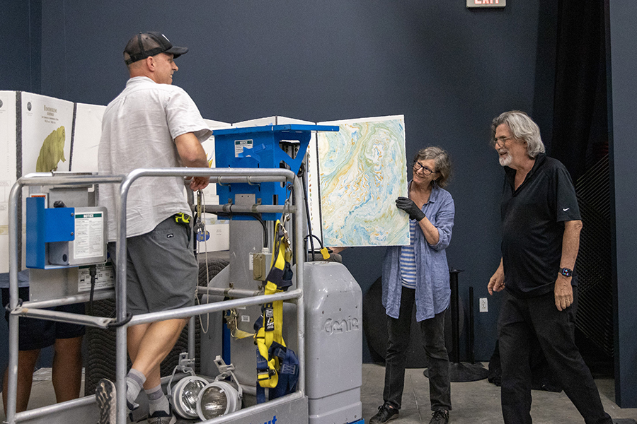 Image: (left to right) Preparator Justin Lowman, artist Gail Wight and curator David Familian work on the installation for Future Tense at the Beall Center for Art + Technology. Photo: Emily Zheng.
