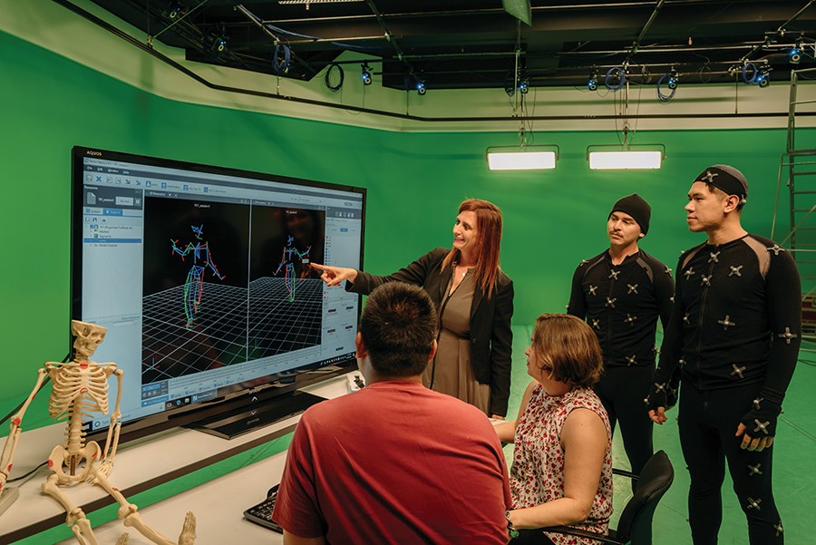 Image: Dr. Sharp and one of her research teams in the CTSA Motion Capture Studio, where they collected and analyzed motion-capture data to investigate movement patterns, responses to stimuli and movement acceleration. Photo: Will Tee Yang.