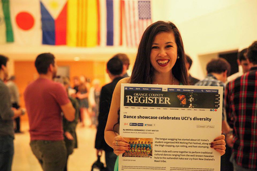 Image: Michelle Maasz Brouwer in 2014 with an OC Register article spotlighting her MIX Melting Pot Festival.