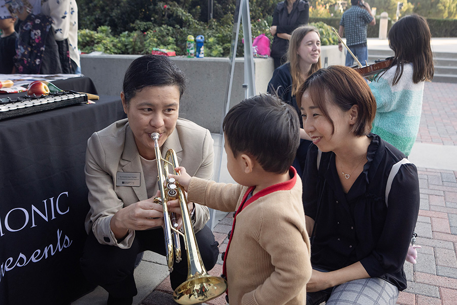 Image: Katherine Yang participating in the Philharmonic Society’s Sound Playground ahead of a sensory-adapted Nutcracker performance with the Irvine Barclay Theatre. Photo by Drew Kelley.