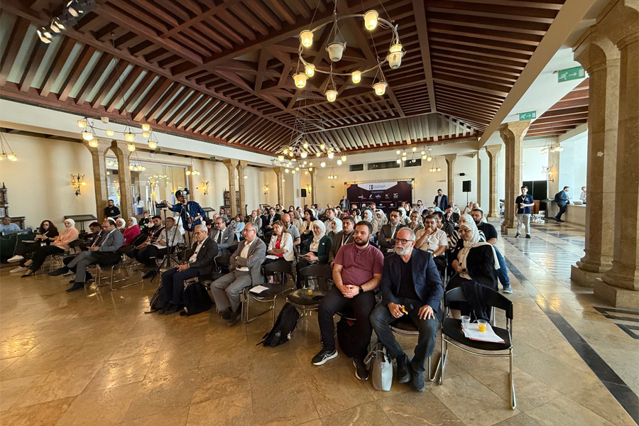 Image: Bryan Reynolds in Damascus, Syria, presenting at the Syrian Academic Summit, Reforming Higher Education in Syria after Liberation, held at Damascus University.