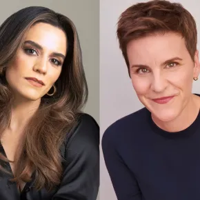 Side-by-side portraits. On the left, Sepideh Moafi, with long brown hair and gold hoop earrings, wears a black satin blouse against a gray background. On the right, Jenn Colella, with short auburn hair, smiles in a navy sweater against a light background.