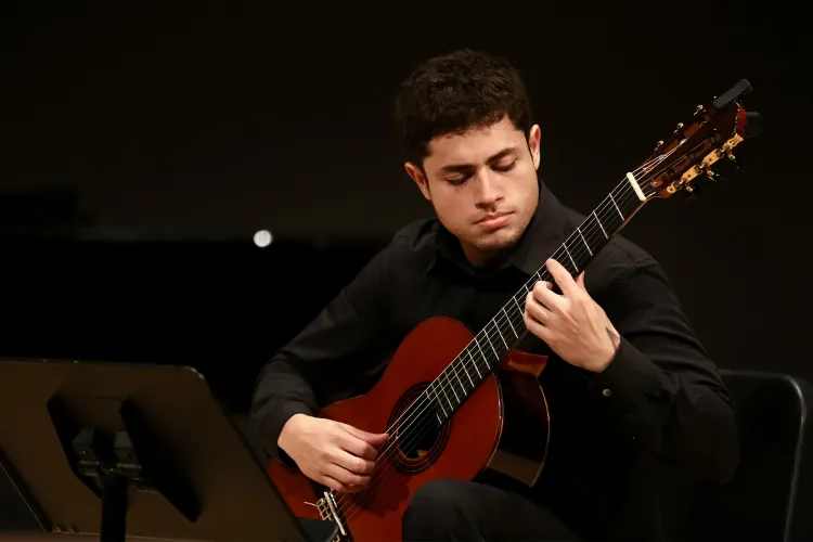 Student playing guitar