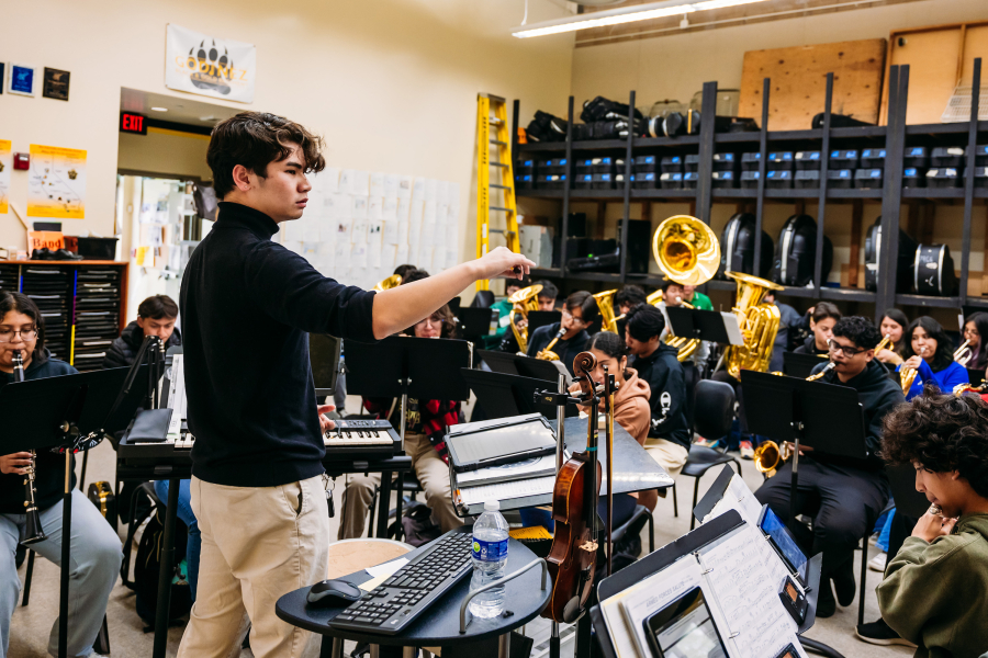 Intern conducting a high school orchestra