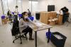  UC Irvine medical students assemble and package face shields produced with 3-D printers and laser cutters at the UCI Beall Applied Innovation Cove in Irvine on Tuesday. The 5,000 face shields will go to UCI Medical Center in Orange. (Kevin Chang / Staff Photographer)
