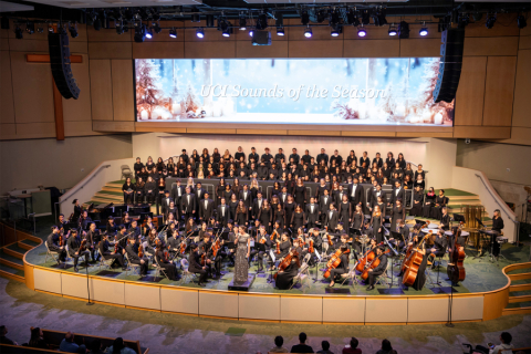 A large choir on stage for a holiday concert