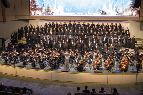 A large choir on stage singing