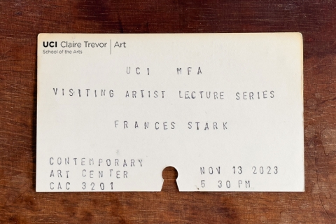 A library index card advertising an upcoming lecture by artist Frances Stark