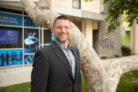 Person in front of tree with glasses