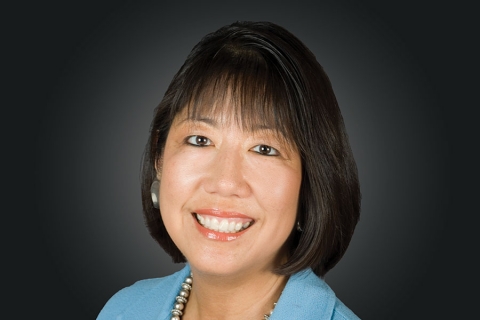 Headshot of Susan Hori: a smiling woman with dark, should-length hair