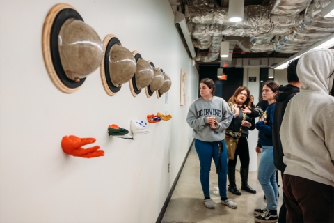 Patrons in a gallery observing art