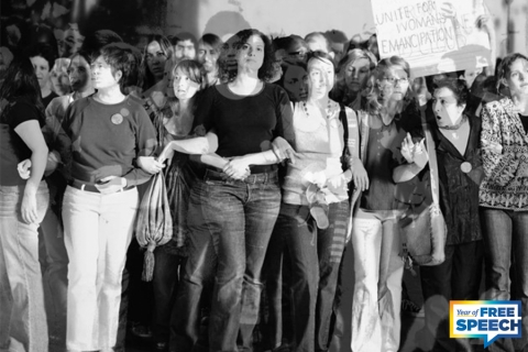 Black and white image of women with arms interlaced