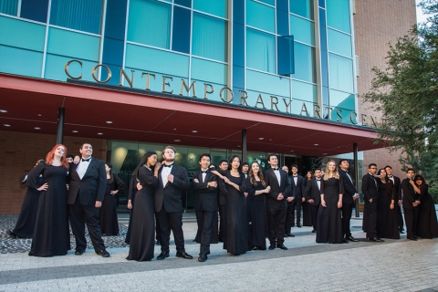 UCI Chamber Singers, dressed to the nines, posing in front of the Contemporary Arts Center lobby
