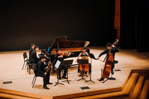 Chamber musicians on stage during a concert
